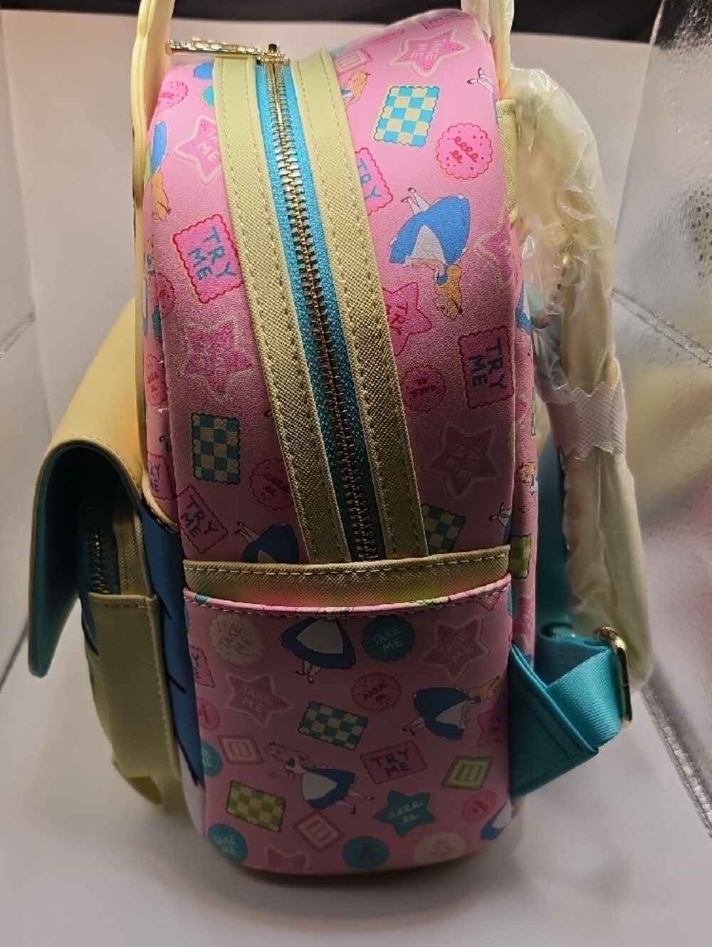 Loungefly Alice in Wonderland Pastel Pink, Yellow & Blue Mini Backpack - Picture 3 of 4